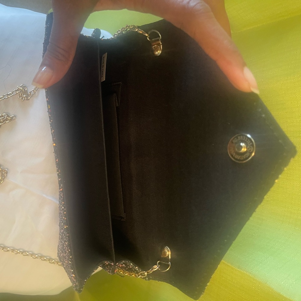 Black/pink/blue/gold clutch with gold chain shoulder strap